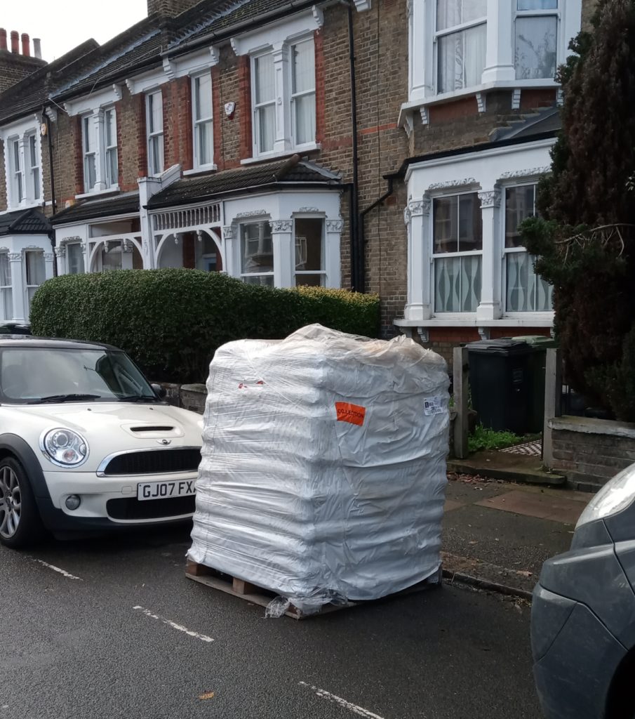 Pallet of wood pellets being delivered in London